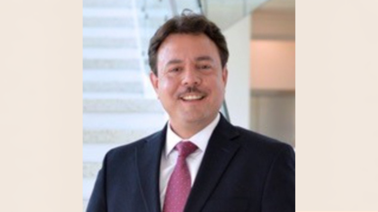 Smiling moustachioed gentleman